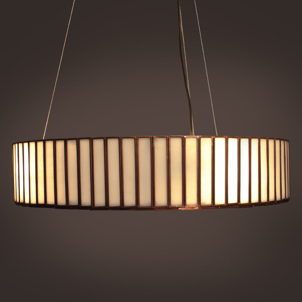Chandelier with cylindrical shade on a dark background
