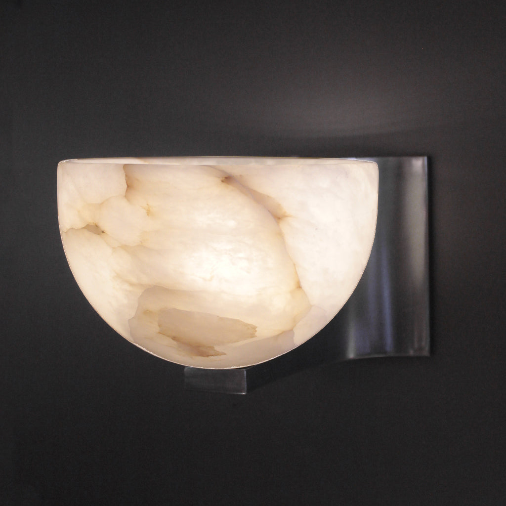 Wall-mounted light fixture with marble-like shade on a dark background