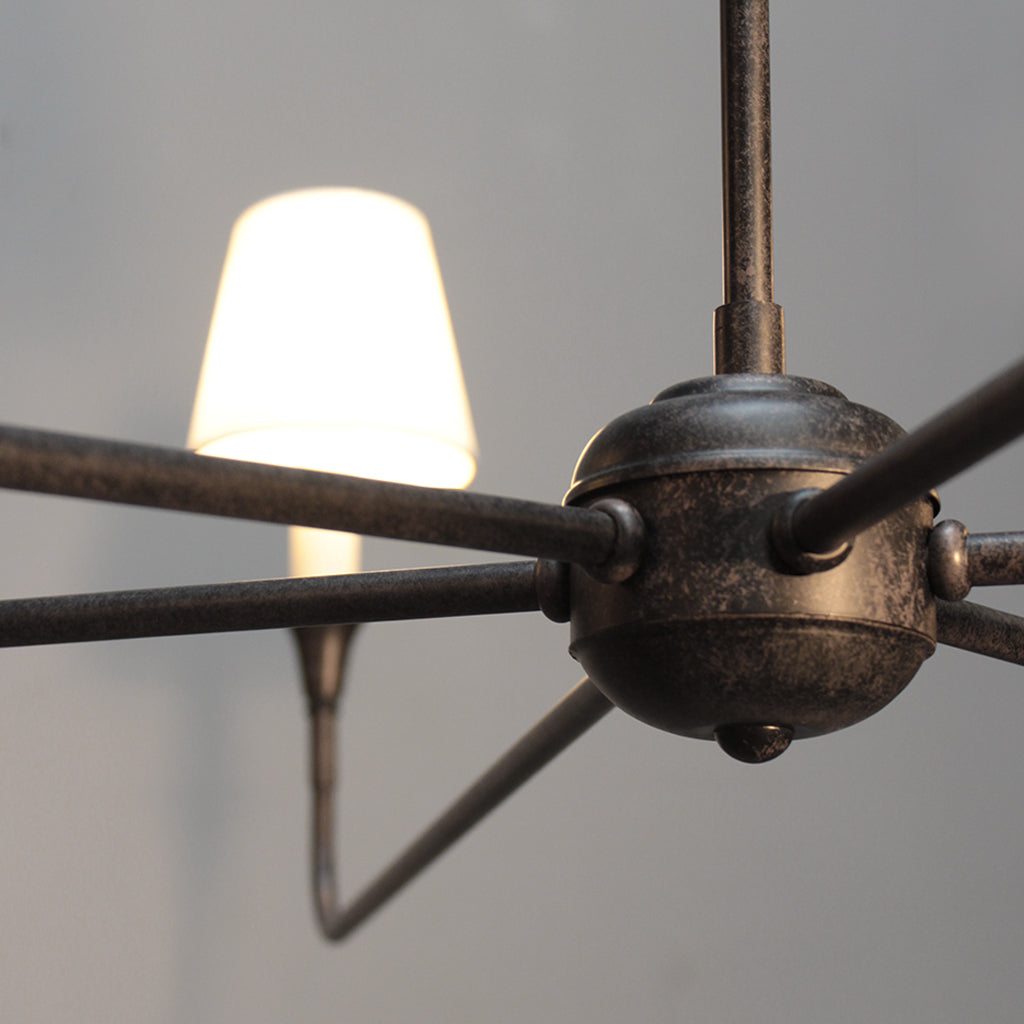 Close-up of a vintage-style ceiling light fixture with a blurred background