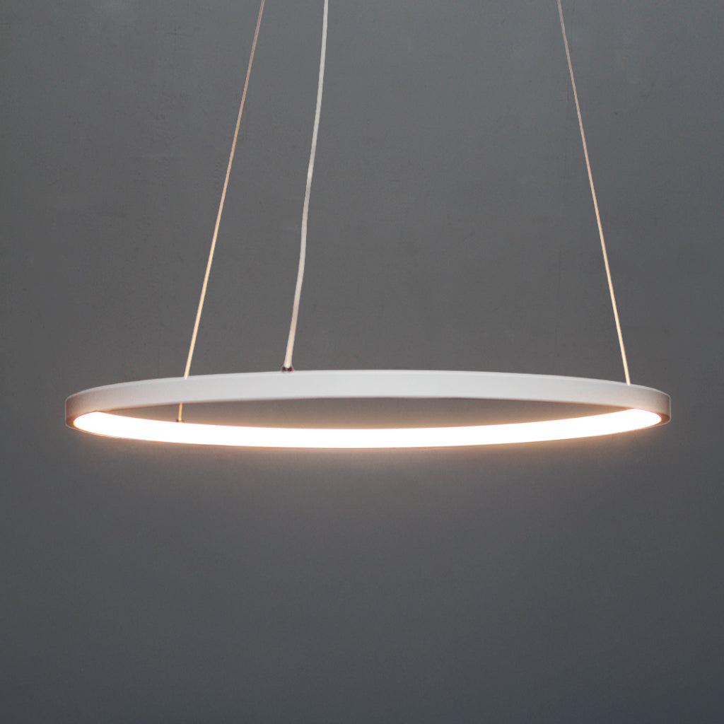 Modern pendant light with a white circular shade on a dark gray background