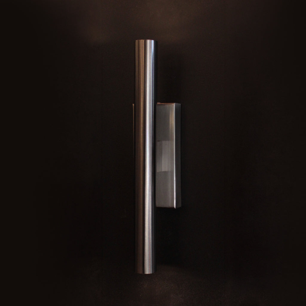 Three wall lights in varying finishes