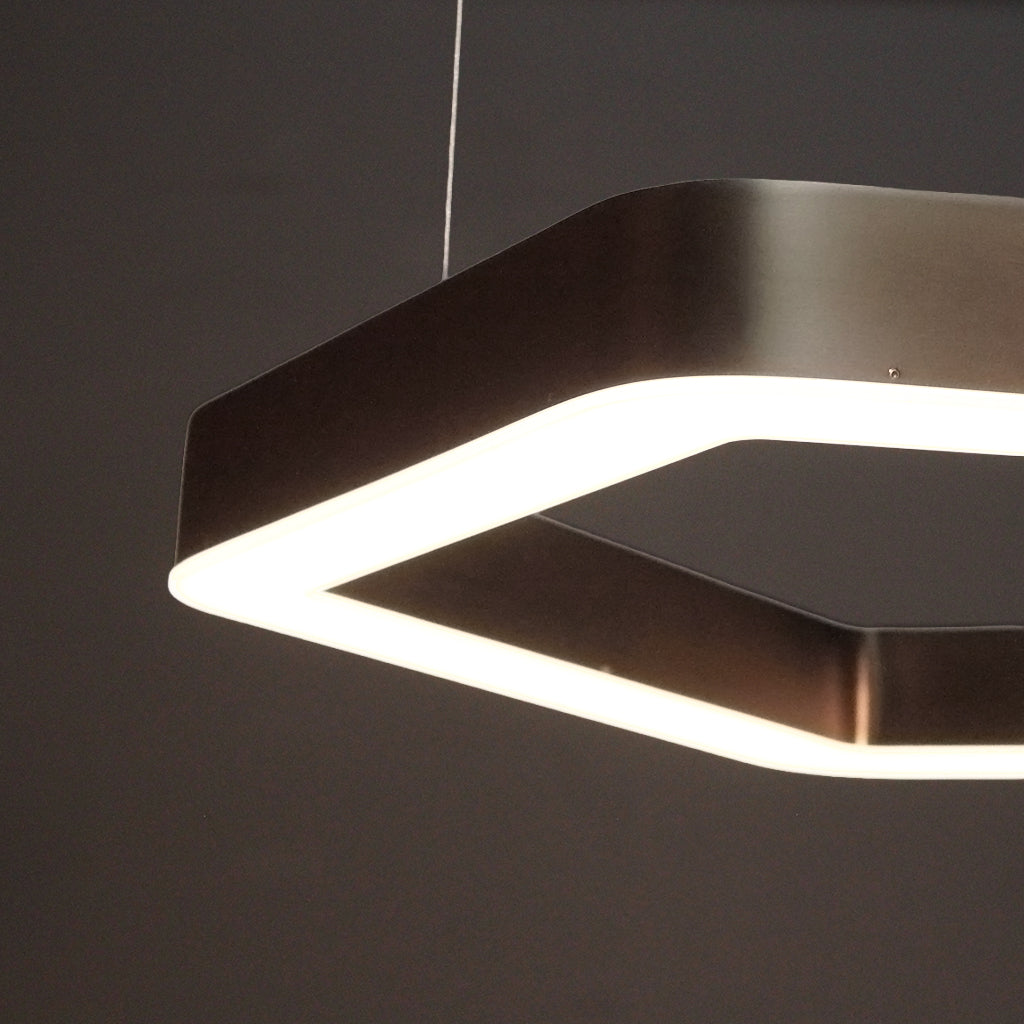 Hexagonal pendant light fixture on a dark background