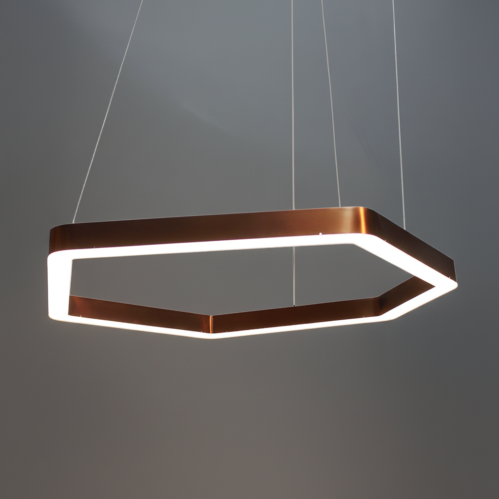 Hexagonal pendant light with copper finish on a white background