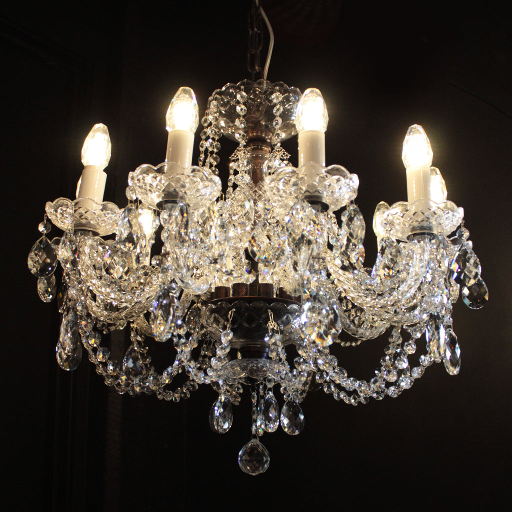 Crystal chandelier with eight light bulbs