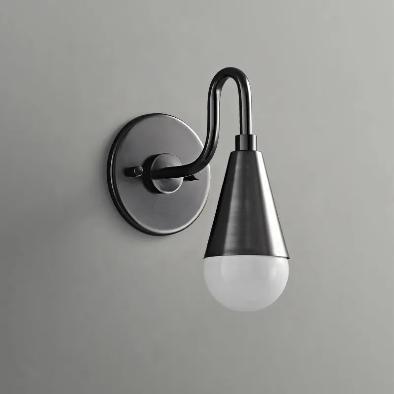 Curved neck wall sconce in metal black finish with white lightbulb on grey wall