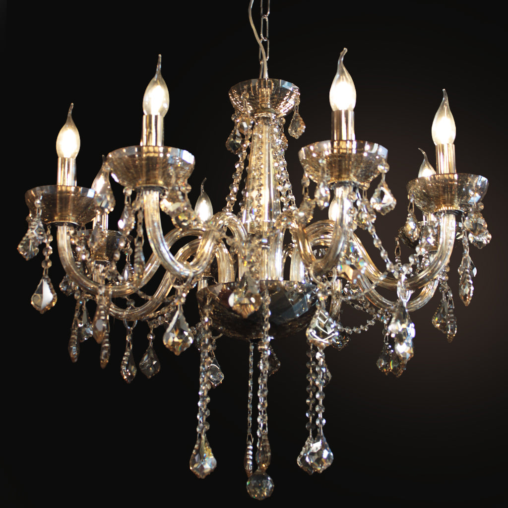 A multi-arm crystal chandelier with a polished silver-toned metal frame, champagne glass arms, and hanging teardrop crystal pendants, shown against a solid black background with illuminated bulbs.