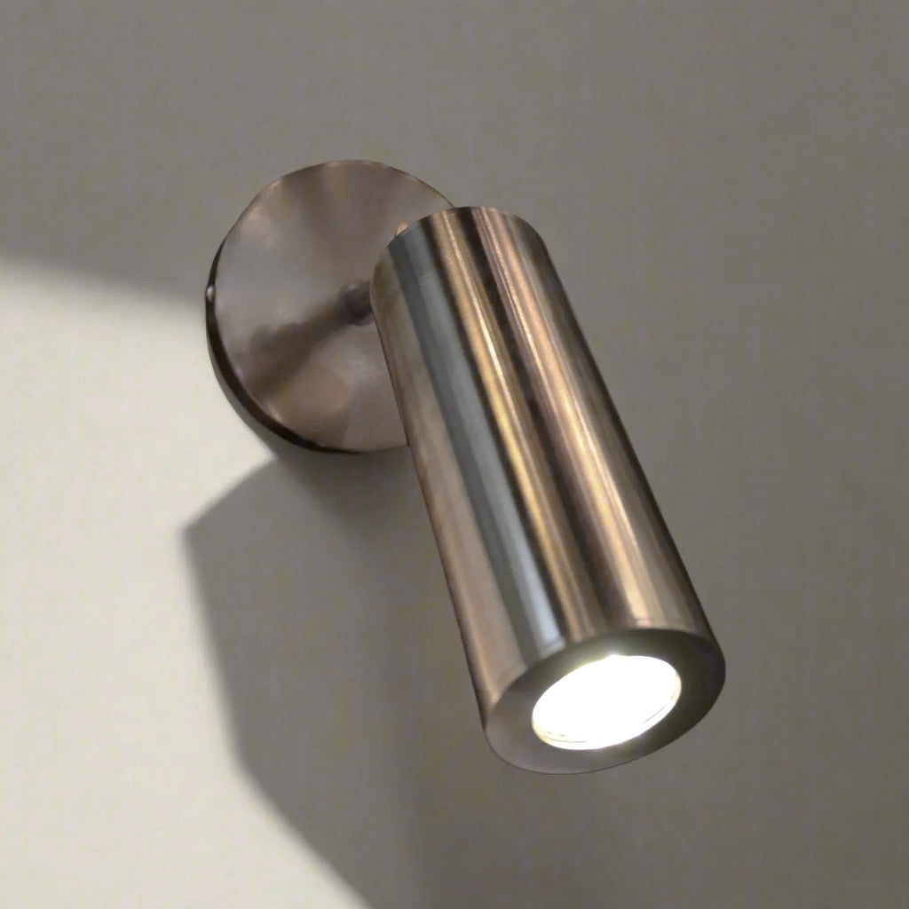 Metal wall light fixture on a plain wall