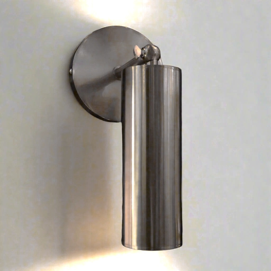 Metal wall light fixture on a plain wall