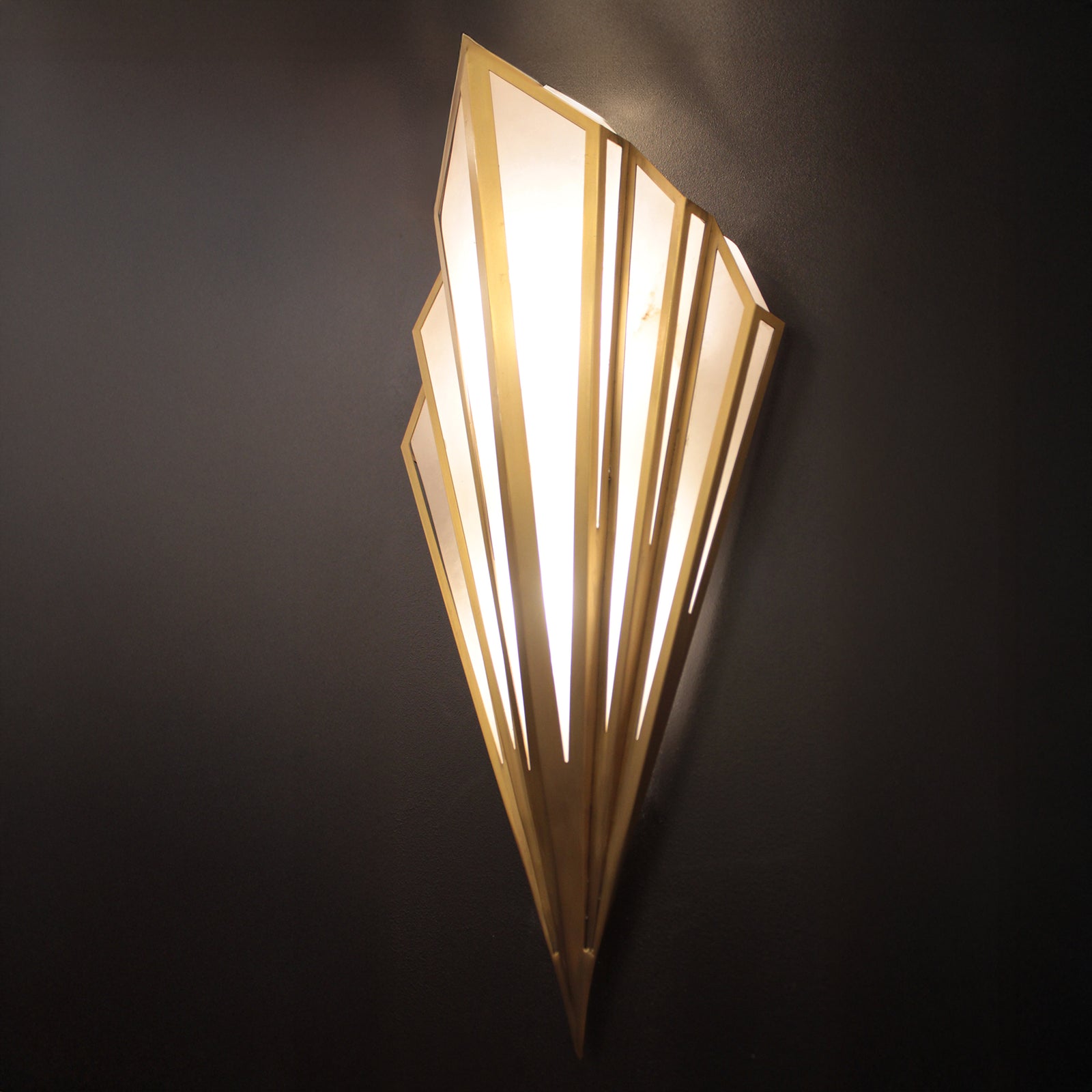 Decorative wall light fixture on a dark background