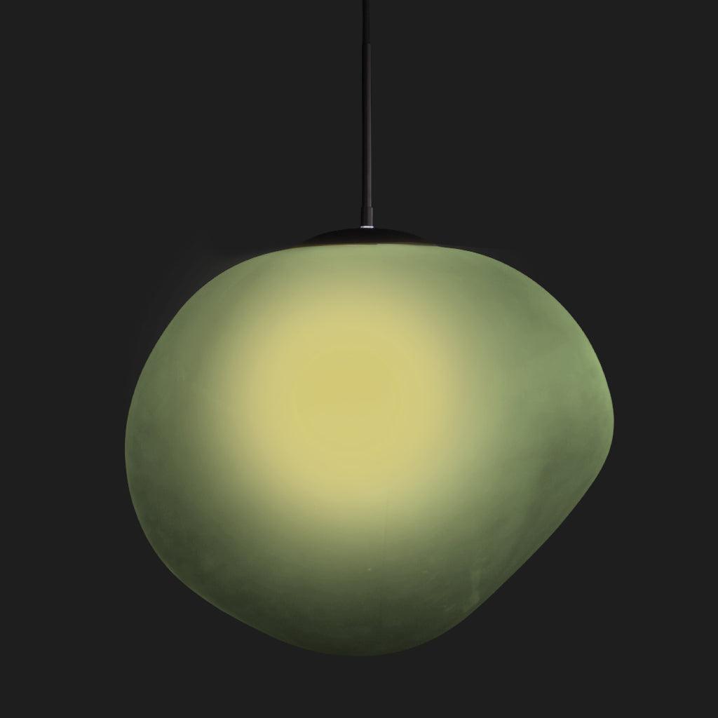 Green pendant light against a black background
