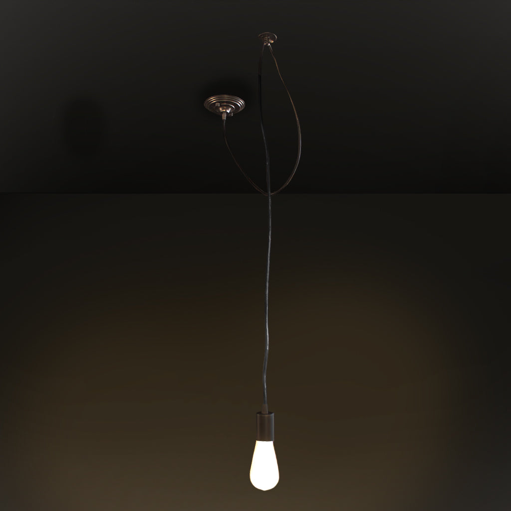 Black swagged pendant light with white bulb against dark background