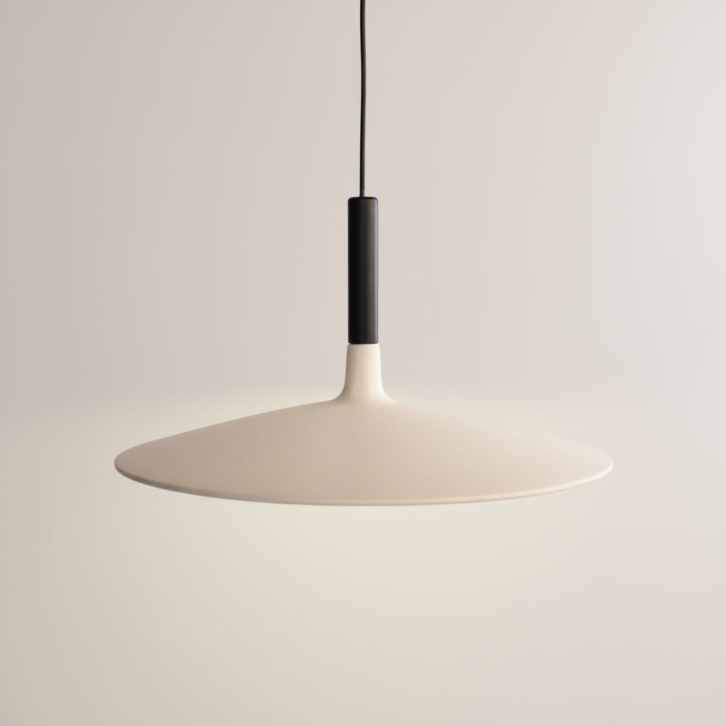 Pendant light with a white shade and black fixture on a dark background